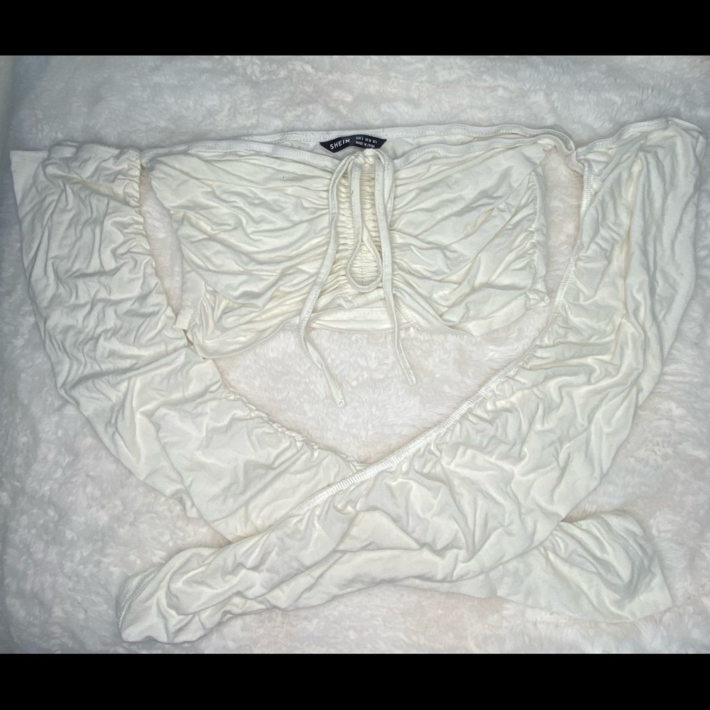 White cropped long sleeve crop top.